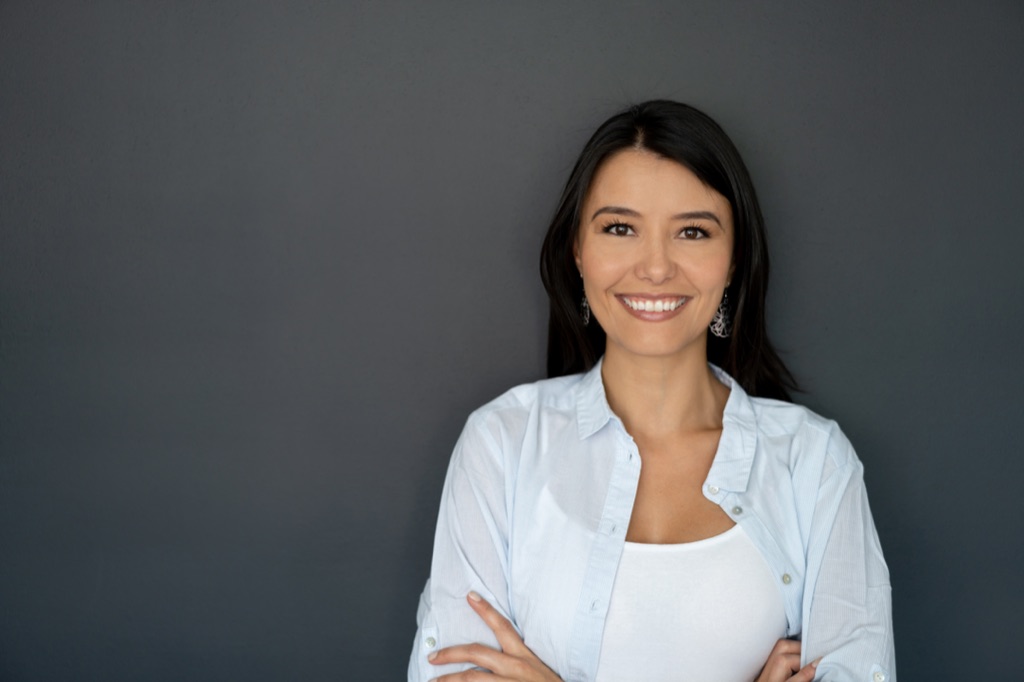 A female teacher working with students in a classroom